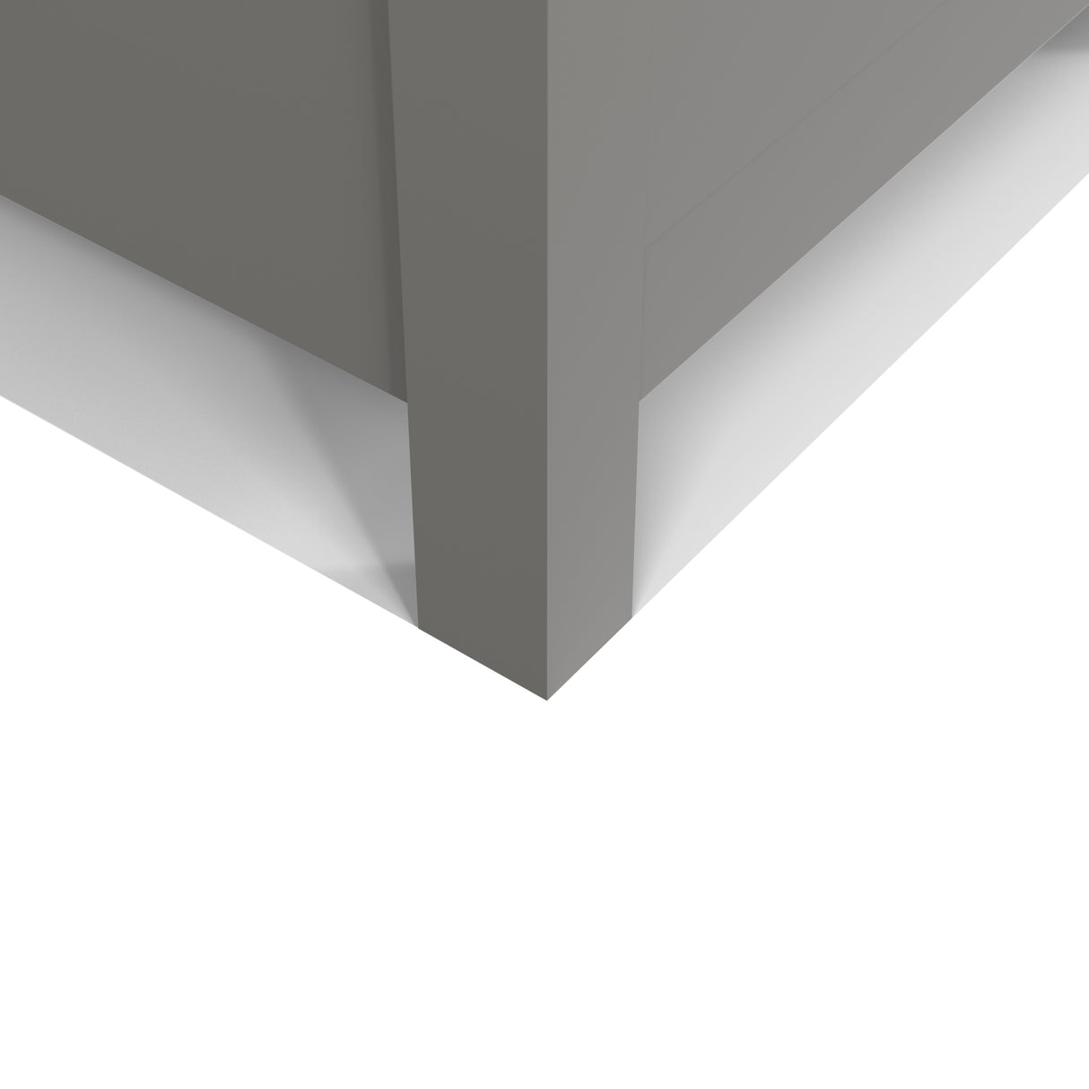 Close-up of a corner where a gray wall meets a white floor.