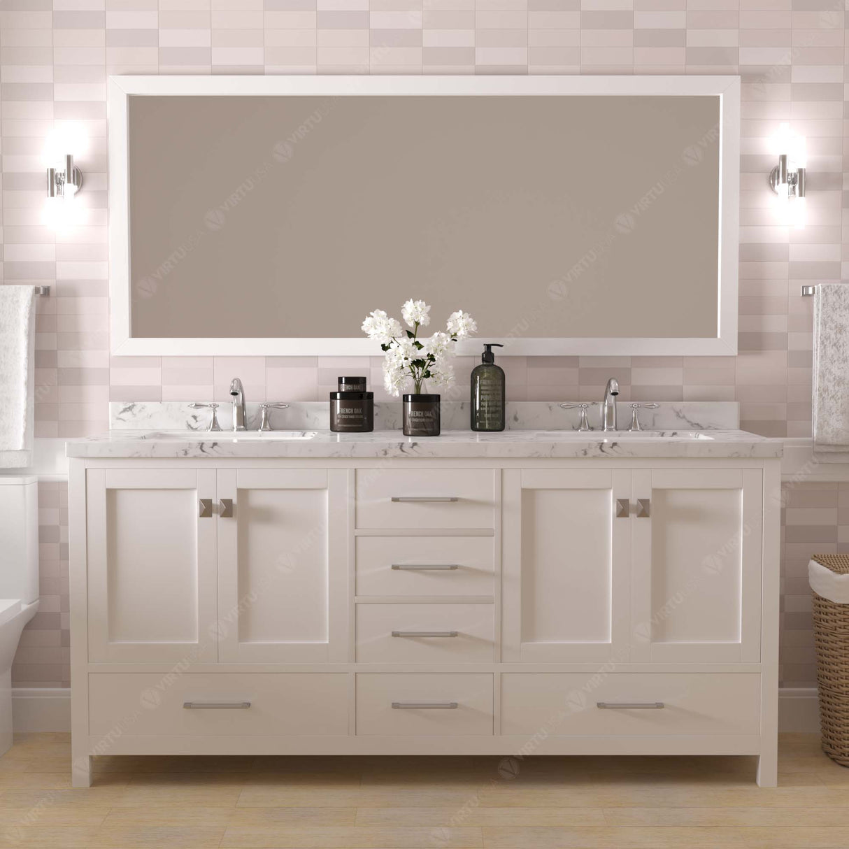 Bathroom with a double vanity, mirror, and decorative elements.